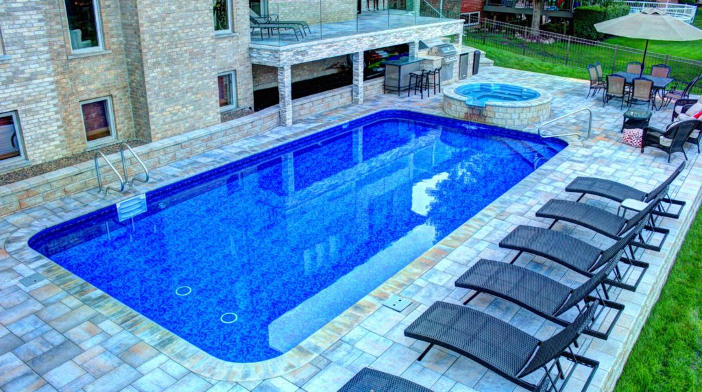 Vinyl Rectangle Pool with Spillover Spa by All Seasons Pools & Spas, Inc.