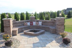 Custom outdoor firepit with paver brick sitting area