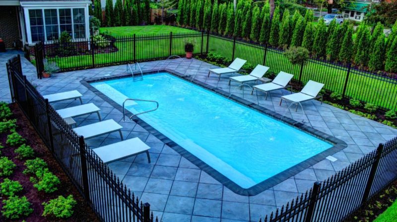 The fiberglass swimming pool with Deck jets and color changing LED lights at Orland Park, IL