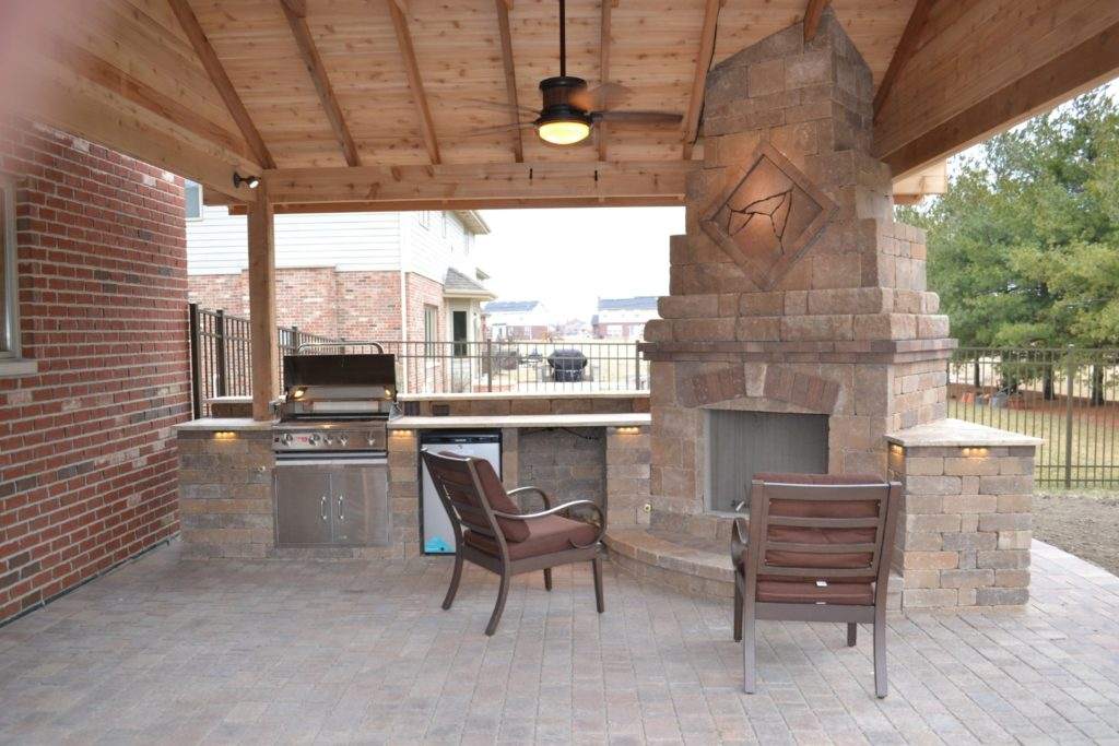 Outdoor kitchen with commercial grade stainless grill and storage doors