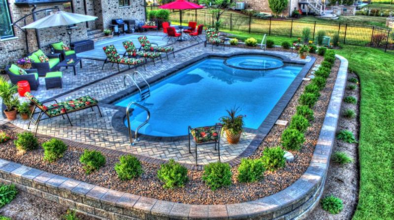 Desert Springs fiberglass pool with an attached spa