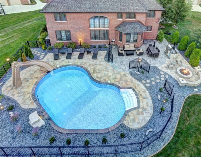 Long site view of swimming pool with home in Orland park