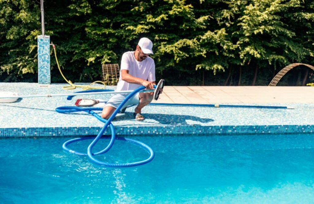 Man cleaning swimming pool in Orland Park, IL
